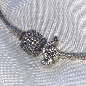 Pandora bracelet and treble clef charm